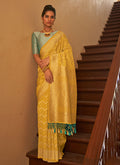 Yellow And Teal Weaved Crape Silk Saree