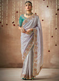 Lavender And Teal Multi Embroidery Tissue Silk Saree